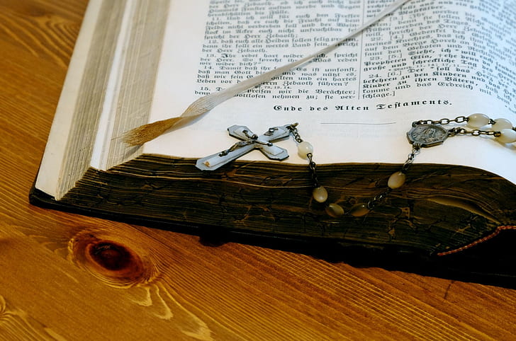 rosary on opened bible