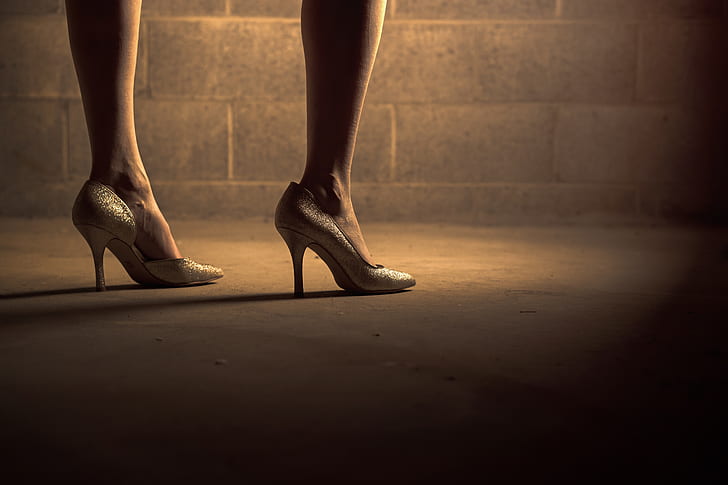 woman in silver pointed-toe heeled shoes