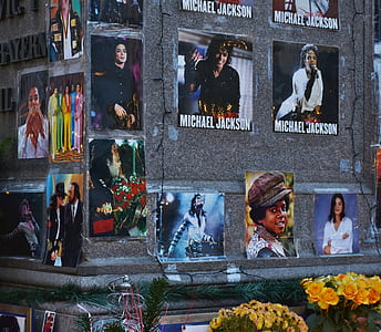 Michael Jackson memorabilia photos on gray wall