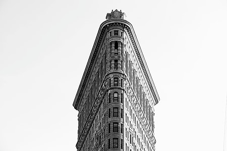 grayscale photography of triangular building in white background