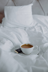 Morning coffee with chocolate in bed