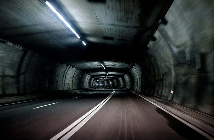 gray concrete empty road inside tunnel