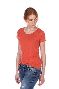 woman in red scoop-neck shirt and blue jeans