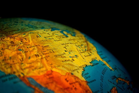 closeup photo of desk globe showing map of USA