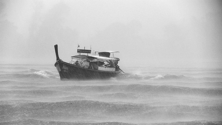 landscape photography of boat during a storm