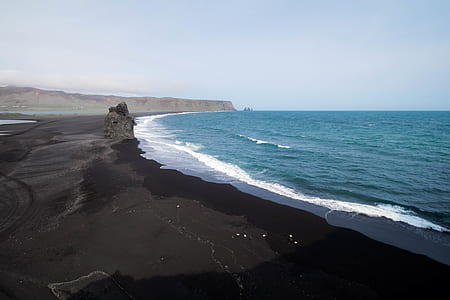 black sand near seashore