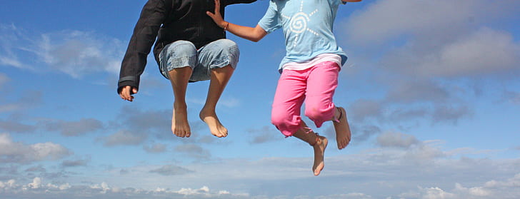 two persons jumping