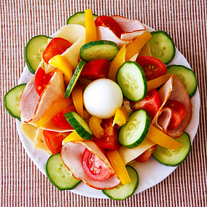 assorted sliced vegetables served on saucer