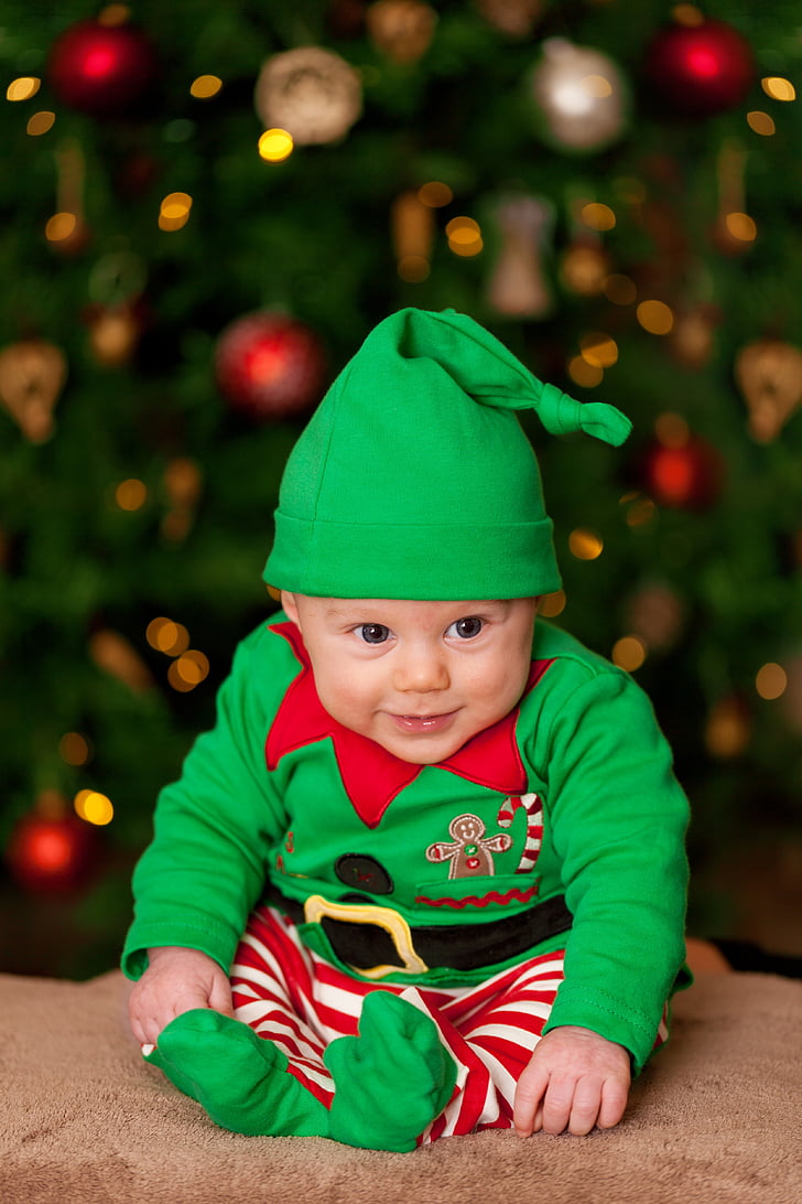 baby wearing green and red elf costume