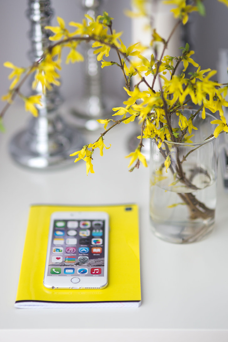 White smartphone with yellow flowers