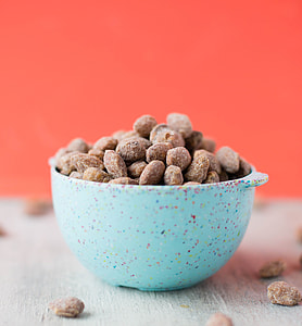 brown nuts in blue bowl