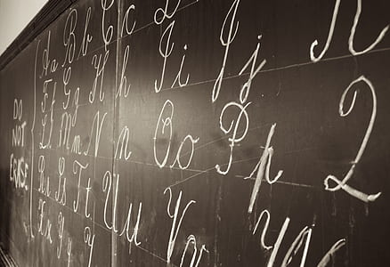 black chalk board with alphabet letters