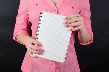 woman holding notebook