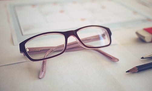 selective focus photography of brown framed eyeglasses