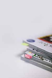 Stack of white magazines with copy space