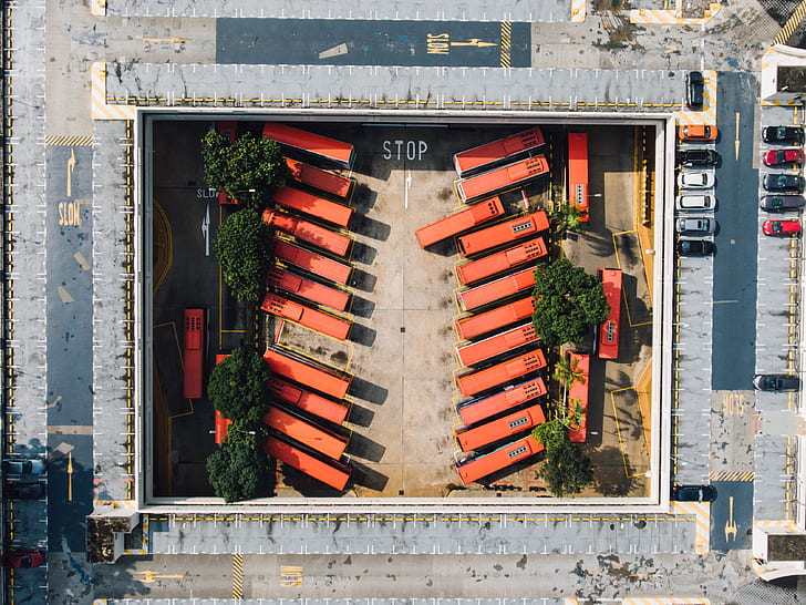 aerial view of orange buses during daytime
