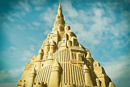 photo of sand castle during daylight