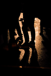 Silhouette photo of people walking on street