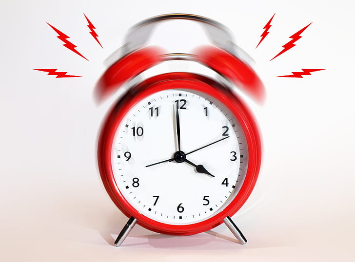 round red alarm clock ringed at 4:00