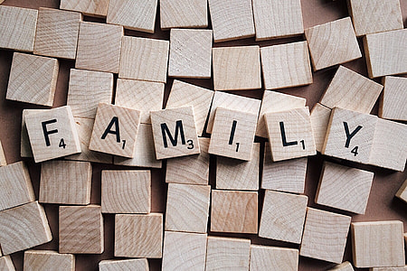 brown scrabble tiles with Family texts