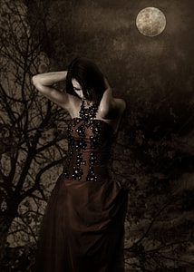 woman in black halter-top dress