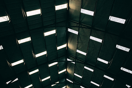Wide angle shot of light patterns coming through the roof of a large building at Chatham Dockyard in Kent, England