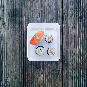 Minimal sushi on wooden background