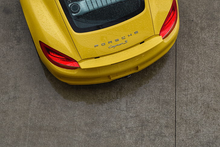 high-angle photography of yellow Porsche coupe