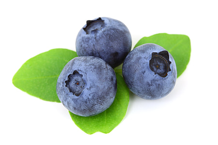 three blueberries against white background