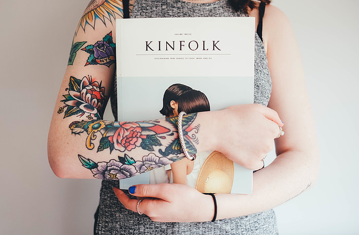 woman holding Kinfolk book