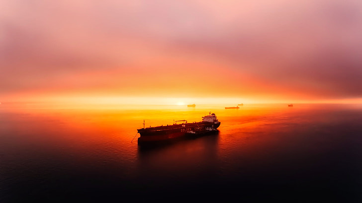 brown ship boat during dawn