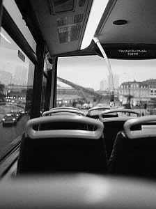 grayscale photo of bus interior