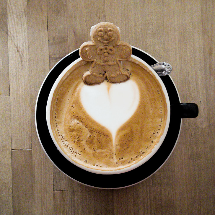 Cute gingerbread cookie floating on a latte heart at Kreuzberg, Ca.