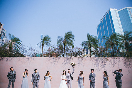 photo of wedding near beige painted wall