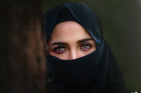 woman in black hiqab viel in shallow focus photography