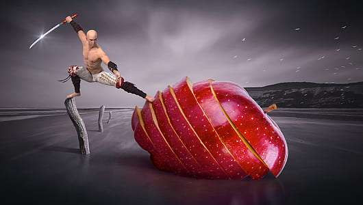 man holding sword slicing large size apple