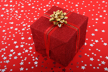red gift box with gold-colored ribbon