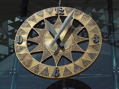 round brown and gray analog clock