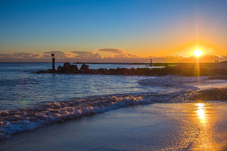 photo of a sunrise on seashore