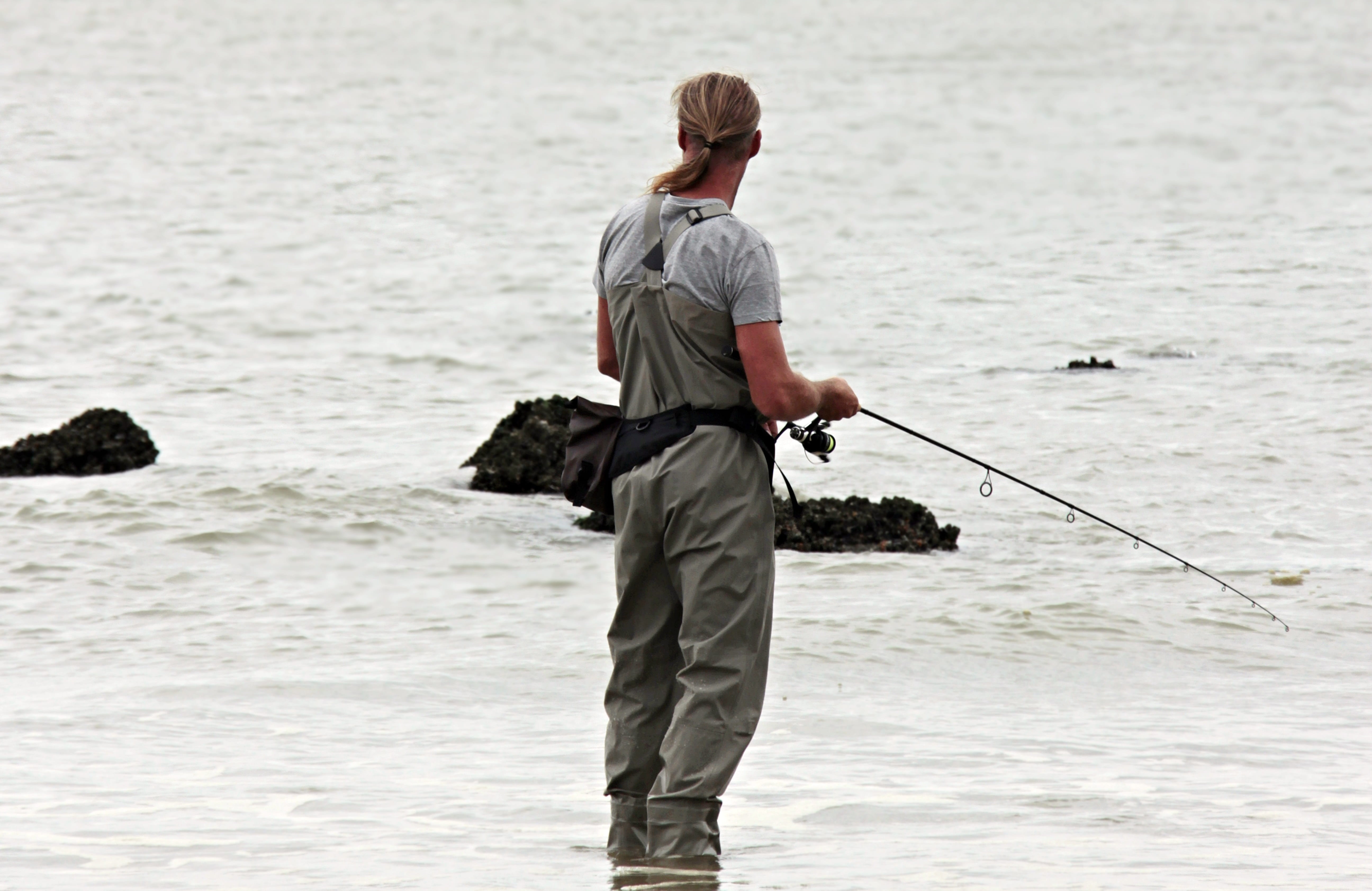 Royalty-Free photo: Man holding fishing rod
