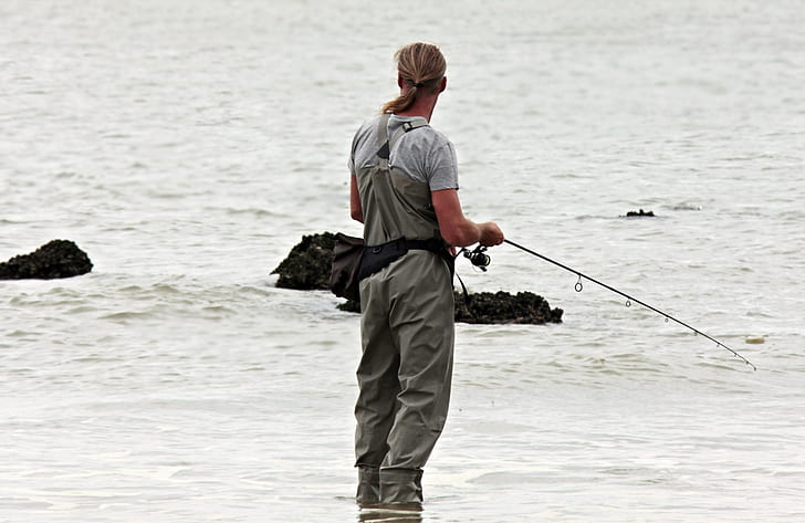 man holding fishing rod