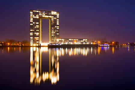 City Building Near Body of Water during Nighttime