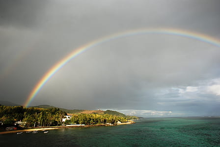 rainbow on shore and sea