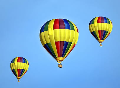 three multicolored balloons