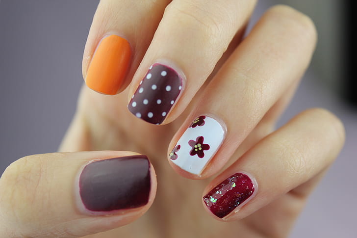 selective focus photography of assorted colored nail art