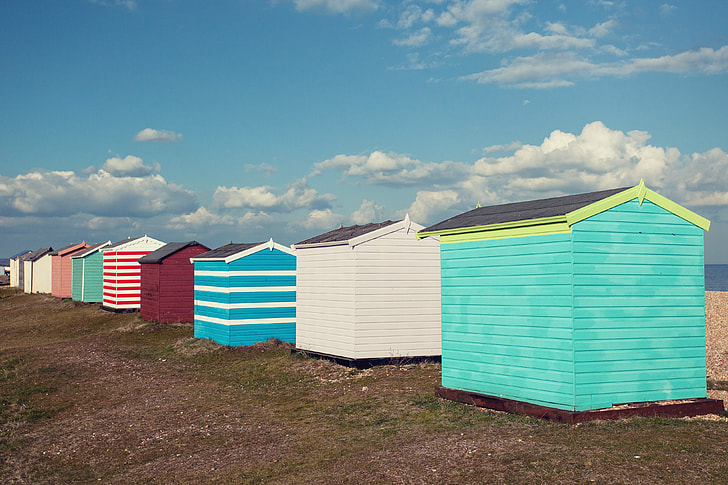 Coloured beach huts sit on the coast of Greatstone in Kent, Southern England. Image captured with a Canon DSLR