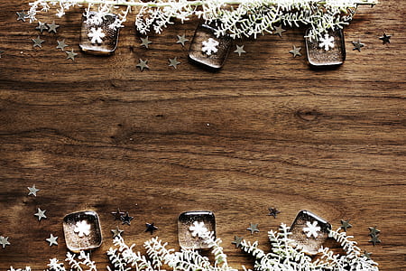 six snowflake paperweights on brown wooden tabletop