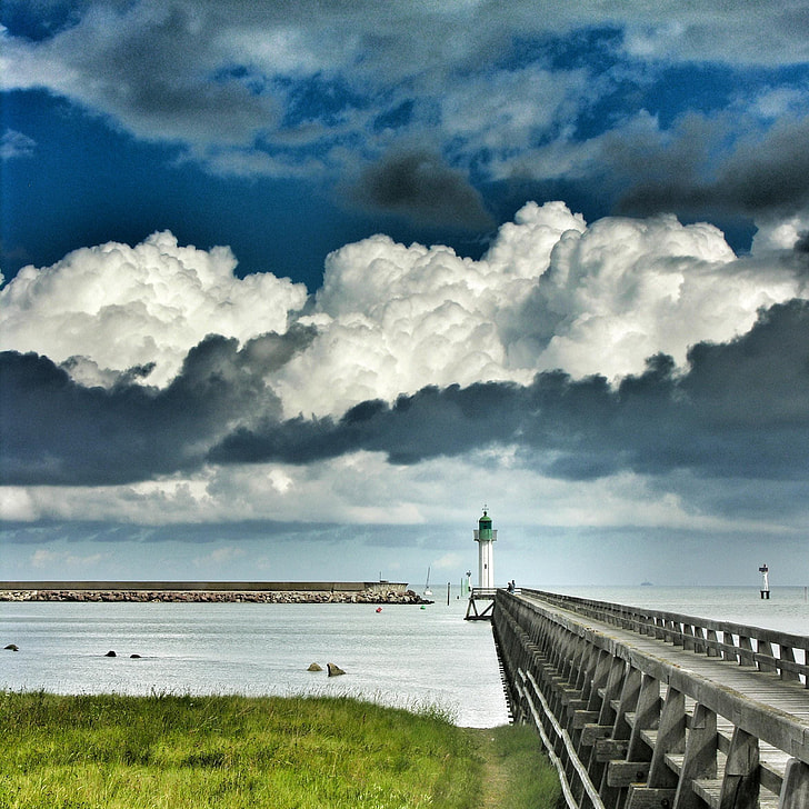white lighthouse under white cloudy sky
