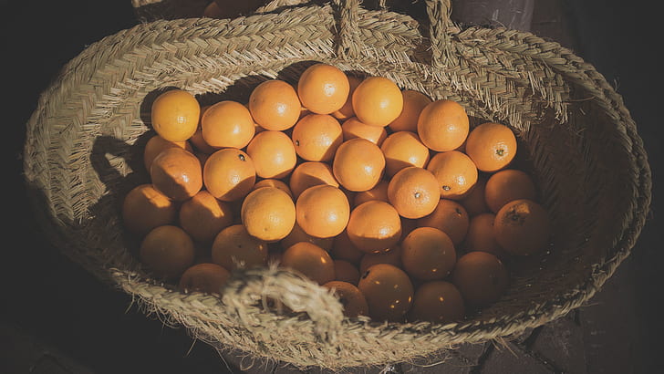 orange fruits in brown basket at daytime