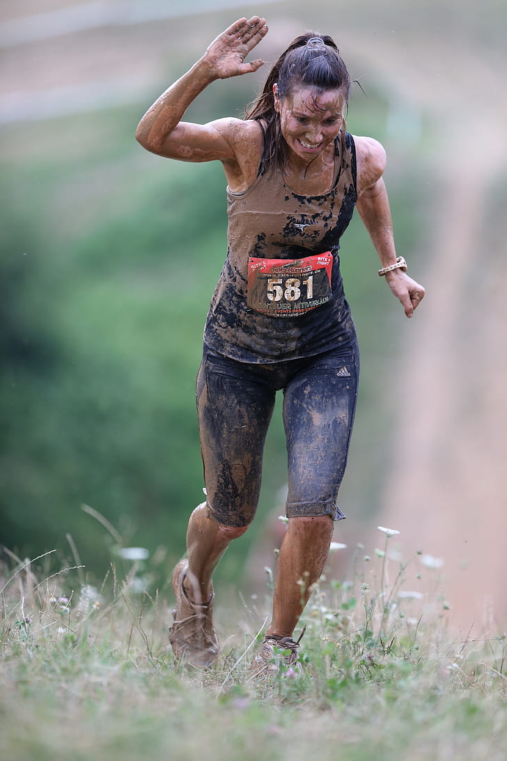 shallow focus photography of woman covered by mud
